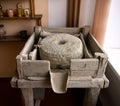 Ancient hand driven millstone device in historical museum Royalty Free Stock Photo