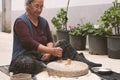 The ancient hand mill or quern stone, grinds the grain into flour. Royalty Free Stock Photo