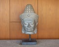 Ancient Hawaiian bust with hat on display in a resort on the Big Island, Hawaii.