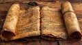 Ancient Hebrew manuscript scroll on a wooden table.