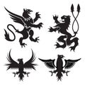 Ancient heraldic griffins symbols of black majestic beasts with body of lion, angel wings and eagle heads. For heraldic design or Royalty Free Stock Photo