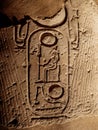 Ancient hieroglyphs depicting pharaohs name on a column at Luxor Temple in Egypt