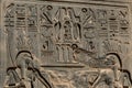 Ancient hieroglyphs and relief engravings carved into a stone wall at Luxor Temple of Amun-Ra Royalty Free Stock Photo