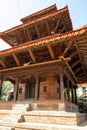 An ancient Hindu four-story temple on a stone pedestal. Durbar Square in Kathmandu, Nepal