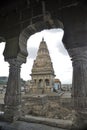 Ancient Hindu temple view through decorative window