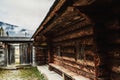 Ancient historic brown wooden house and gate overlooking the misty mountains