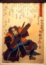 Ancient historic document on pergament with calligraphy an drawing of a big samurai holding a weapon displayed at the Samurai
