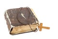 Ancient holy book of a wooden cross on a cord