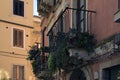 Ancient house with beautiful authentic decorated balconies with blooming potted flowers, succulents and cacti Royalty Free Stock Photo