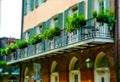 Ancient house on Bourbon Street and beautiful balconies. French Quarter, New Orleans Royalty Free Stock Photo