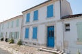 Ancient house white wall and colors shutter in Ile d`Aix in France island