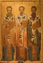 Ancient icon of The Three Hierarchs - Basil the Great,  Gregory the Theologian and John Chrysostom. Thessaloniki, Greece Royalty Free Stock Photo