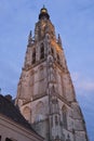 Ancient illuminated church tower by twilight, Breda, Netherlands