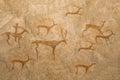 An ancient image of animals on a cave wall painted by an ancient man.