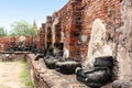 Ancient incomplete sculptures of Buddha in temple ruins. Ayutthaya, Thailand.