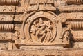 Ancient indian people with cow on temple wall, India. Indian architecture in Pattadakal, Carvings of 7th century