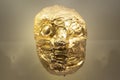 Ancient indigenous golden mask representating a jaguar face