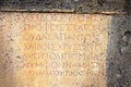 Ancient inscription on a wall of ancient theater in the Roman city the Hierapolis, Turkey