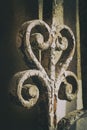 Ancient iron gate decoration swirly detail with rusty parts Royalty Free Stock Photo