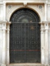 Ancient iron gate with marble surround, Venice, Italy