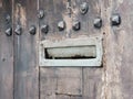 Ancient iron letterbox on brown wooden background Royalty Free Stock Photo