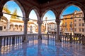 Ancient Italian square arches and architecture in town of Udine