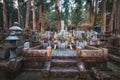 Ancient Japanese Graveyard inside Forest in Okunoin Cemetery, Koyasan, Japan Royalty Free Stock Photo