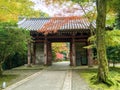 Ancient Japanese temple arched entrance in the autumn season park Royalty Free Stock Photo