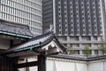 Ancient Japanese tile roofs against modern sky-scrapers are in center of Tokyo city, Japan Royalty Free Stock Photo