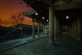 Ancient Japanese wooden temple building and courtyard with orange sunset sky. 3D illustration