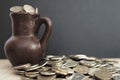 Ancient jug with coins. Old coins in a pot. Royalty Free Stock Photo