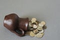 Ancient jug with coins. Old coins in a pot.