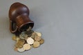 Ancient jug with coins. Old coins in a pot. Royalty Free Stock Photo