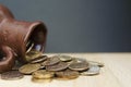 Ancient jug with coins. Old coins in a pot. Royalty Free Stock Photo