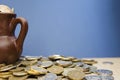 Ancient jug with coins. Old coins in a pot. Royalty Free Stock Photo