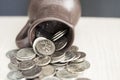 Ancient jug with coins. Old coins in a pot. Royalty Free Stock Photo