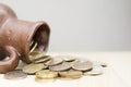 Ancient jug with coins. Old coins in a pot. Royalty Free Stock Photo