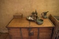 Ancient jug, plate, cups, sauser and teapot on the table