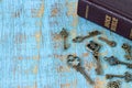 Ancient keys and closed holy bible book on wooden table Royalty Free Stock Photo