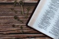 Ancient keys and open holy bible book on wooden table, top view Royalty Free Stock Photo