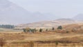 Ancient Kyrgyz cemetery with stone buildings in Shabdan village, Kyrgyzstan