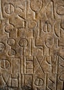Ancient language carved in stone Royalty Free Stock Photo