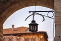 Ancient lantern on medieval buildings Royalty Free Stock Photo