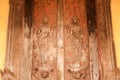 Ancient Laos art wood carving on church in Si Saket temple in Laos. Royalty Free Stock Photo