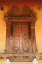 Ancient Laos art wood carving on church in Si Saket temple in Laos. Royalty Free Stock Photo