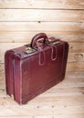 Ancient luggage on wood floor background is wood Royalty Free Stock Photo