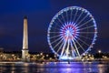 Ancient Luxor Obelisk and Big Wheel at Place de la Concorde in the late evening in Paris Royalty Free Stock Photo