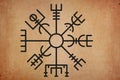 Ancient magic rune Scandinavian and Germanic mythology symbol sun wheel on grunge background