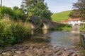 Autumn view of ancient Malmsmead bridge and ford