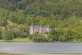 Ancient manor of Mor Trossachs, facing Loch Achray, surrounded by thick woods Royalty Free Stock Photo